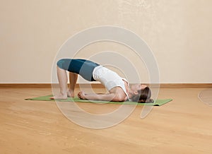 Caucasian woman is practicing yoga
