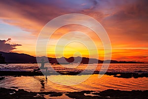 Caucasian woman practicing yoga at seashore