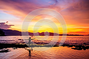 Caucasian woman practicing yoga at seashore