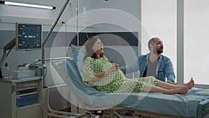 Caucasian woman with pregnancy having painful contractions