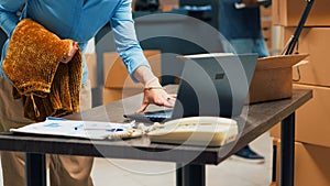 Caucasian woman preparing order shipment fom warehouse