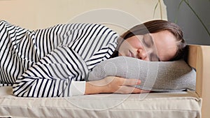 Caucasian woman resting at home on couch, feeling exhausted after work, lacking energy or being overworked too tired and lacking