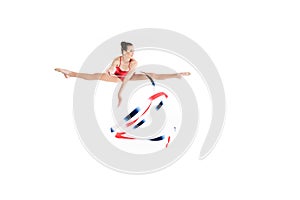 Caucasian woman rhythmic gymnast jumping with colorful rope