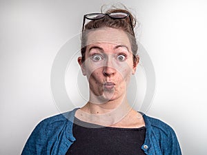 Caucasian woman showing an expression of surprise