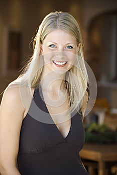 Caucasian woman smiling.