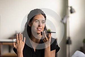 Caucasian woman talk on loudspeaker on smartphone