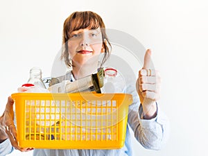 Caucasian woman with trash ready for recycling