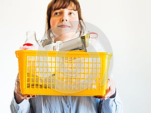 Caucasian woman with trash ready for recycling