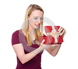 Caucasian woman unwrap of gift box