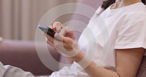 caucasian woman using smartphone device at home.