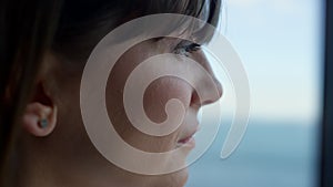 Caucasian woman watching sea view window office. Lady thinking business ideas