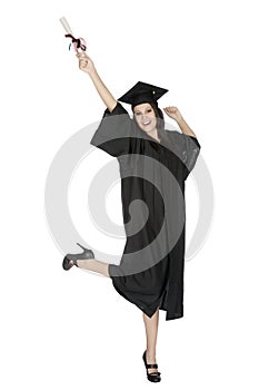 Caucasian woman wearing in a black graduation gown