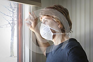 Caucasian woman wearing a protective face mask due to caronavirus