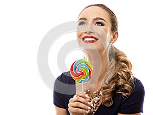 Caucasian woman wearing swimsuit, hat and holding lollypop