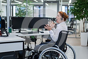 Caucasian woman in a wheelchair yells. Nervous breakdown female call center worker.