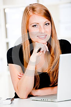 Caucasian Women with Pen and Laptop