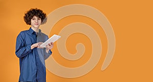 Caucasian young man's portrait isolated on yellow studio background with copyspace