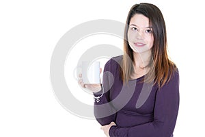 Caucasian young woman drinking coffee or tea smiling at camera with blank white copy space