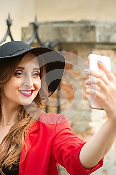 Caucasian young woman taking selfie