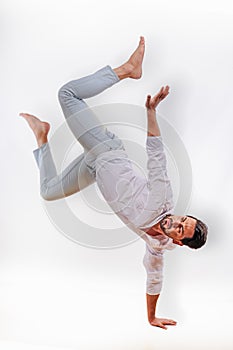 Caucasianman having handstand posing in studio