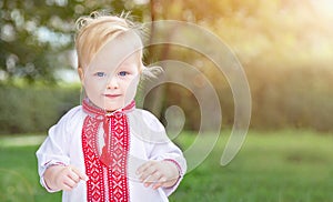 Caucasians baby (boy) in Ukrainian vyshyvanka shirt (national clothing, symbol of Ukraine).