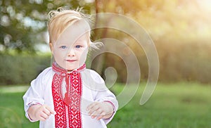 Caucasians baby (boy) in Ukrainian vyshyvanka shirt (national clothing, symbol of Ukraine). photo