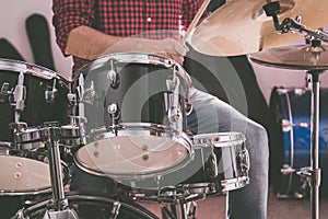 Caucasican young man playing drums