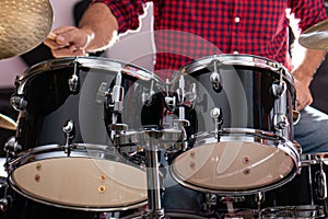 Caucasican young man playing drums