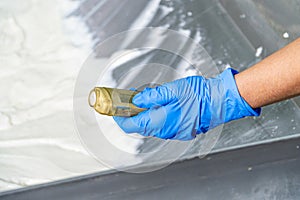 caucasion woman working in a food factory wearing protective clothes and gloves