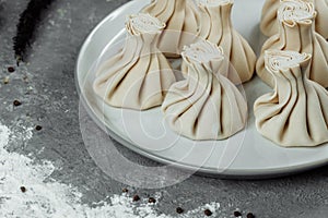 Caucasuan cuisine - Khinkali with meat on a white plate