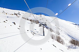 Caucasus Mountains, Panoramic view of the ski slope  on the horizon in winter day. Dombai ski resort, Western Caucasus, Karachai-