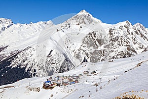 Caucasus Mountains, Panoramic view of the ski slope  on the horizon in winter day. Dombai ski resort, Western Caucasus, Karachai-