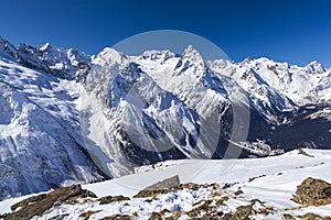 Caucasus Mountains, Panoramic view of the ski slope  on the horizon in winter day. Dombai ski resort, Western Caucasus, Karachai-