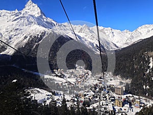 Caucasus Mountains, Panoramic view of the ski slope on the horizon in winter day. Dombai ski resort, Western Caucasus, Karachai-