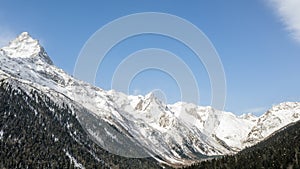 Caucasus Mountains, Panoramic view of the ski slope with the mountains Belalakaya, Sofrudzhu and Sulakhat on the horizon in winter