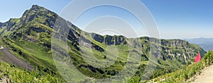 the Caucasus Mountains from Polyana peak in Sochi, Russia on a sunny summer day - panorama