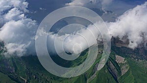 Caucasus mountains under clouds photo