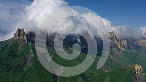 Caucasus mountains under clouds photo