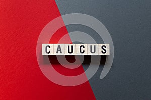 Caucus - word concept on cubes photo