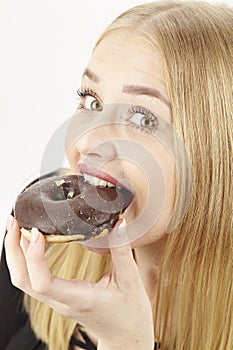 Caught - she eats a donut
