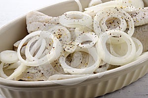 Caught herring and sliced onionring