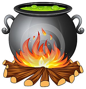 Cauldron with boiling green potion on wood fire photo