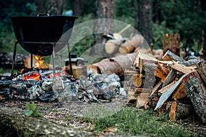 A cauldron for cooking is on the fire