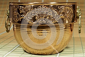 Cauldron of copper with engraved motifs