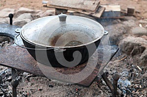 Cauldron is by covered by lid for pilaff cooking. Rice pilaf cooking series photo