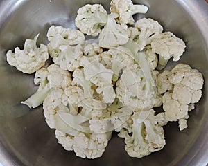 Cauliflower pieces kept in a container. photo