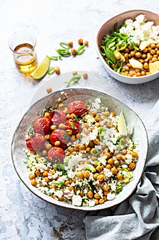 Cauliflower rice bowl with chickpeas and roasted tomatoes