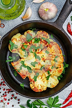 Cauliflower steak with parsley, garlic and spices