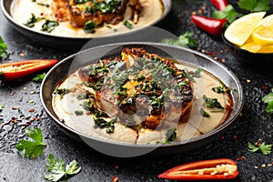 Cauliflower steaks with chimichurri sauce and butter bean puree