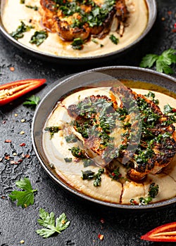 Cauliflower steaks with chimichurri sauce and butter bean puree